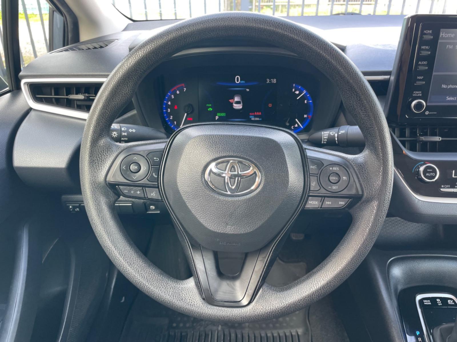 2022 Blue /Silver Toyota Corolla LE (JTDEAMDEXNJ) with an 1.8L Hybrid engine, Automatic transmission, located at 1501 West 15th St., Houston, 77008, (713) 869-2925, 29.797941, -95.411789 - Photo #9
